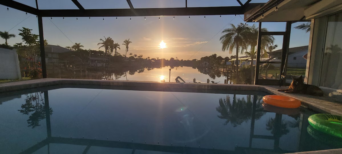 Morning coffee and croissants on the dock at sunrise