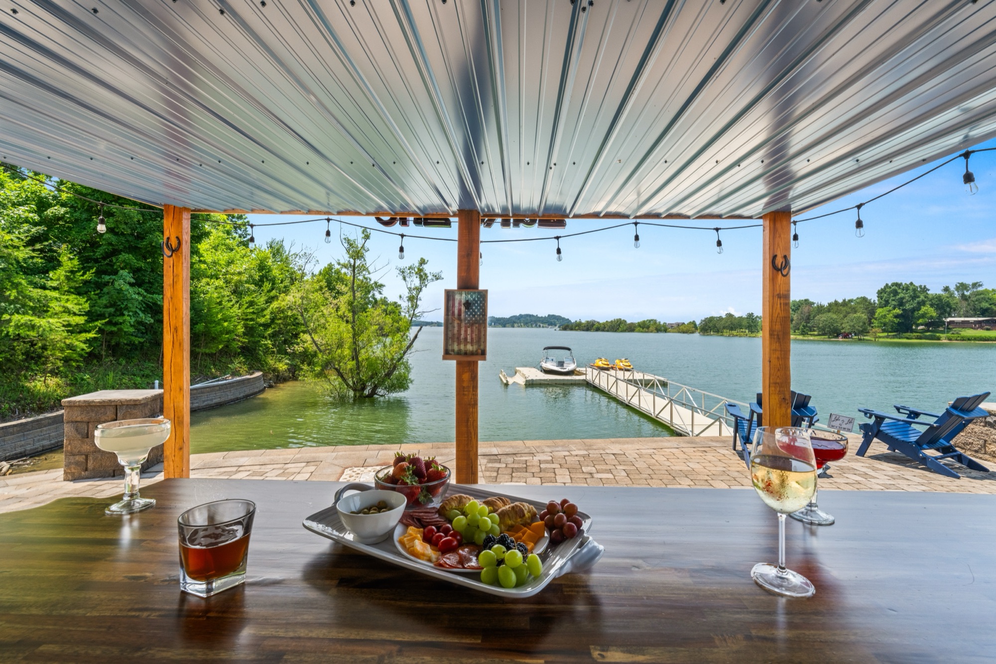 Charcuterie and drinks on the pavilion bar table overlooking the floating dock