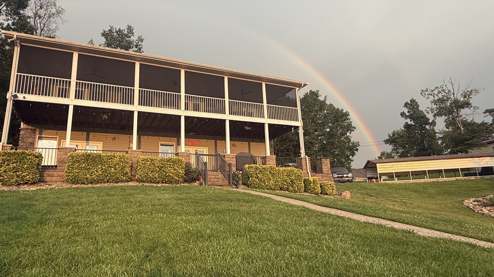 Rainbow arching over the two 48-foot porches of Fort Sunsets